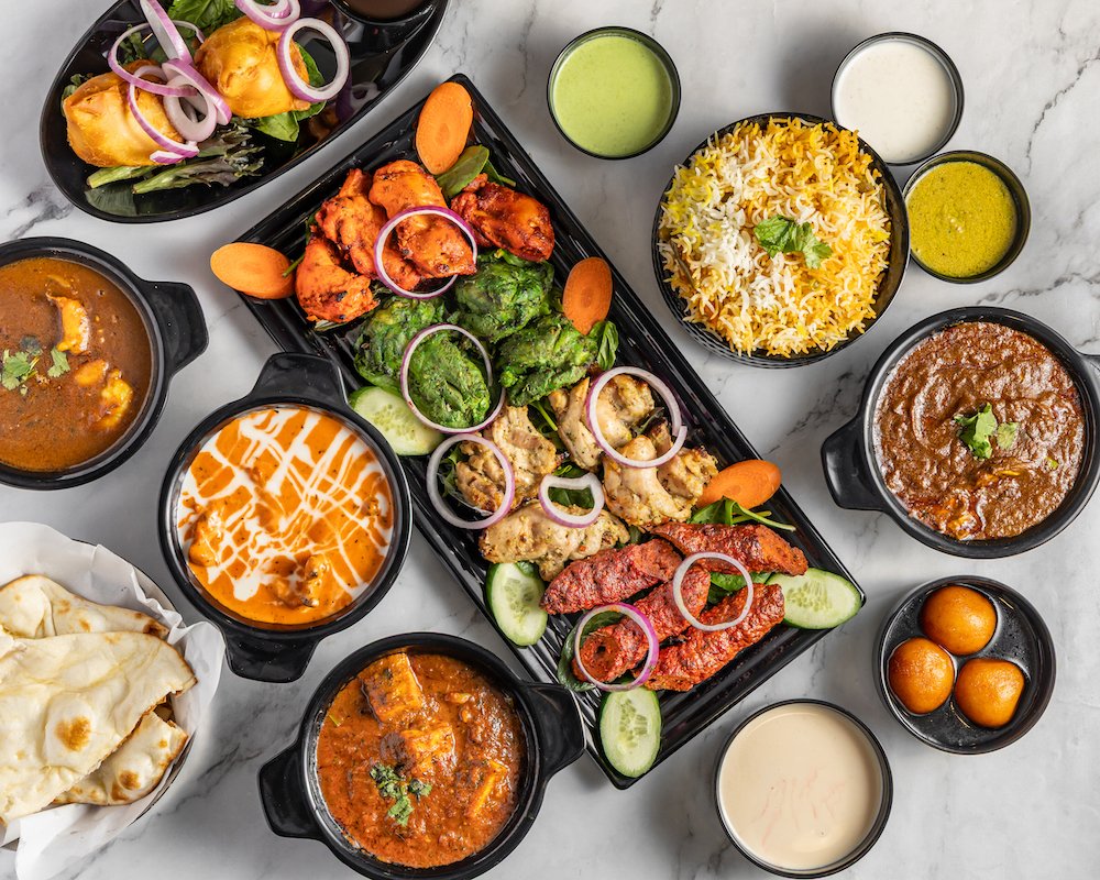 Warm ambience and platter of Indian dishes